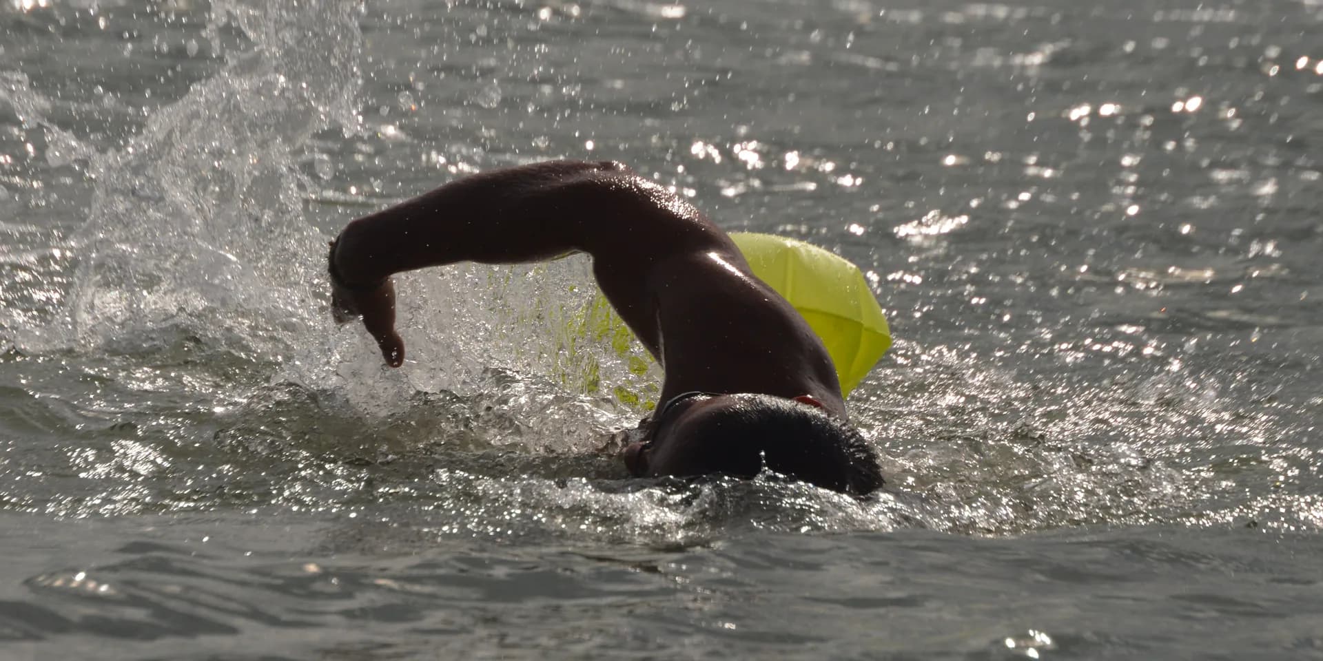 Open-water swimmer moving through the sea