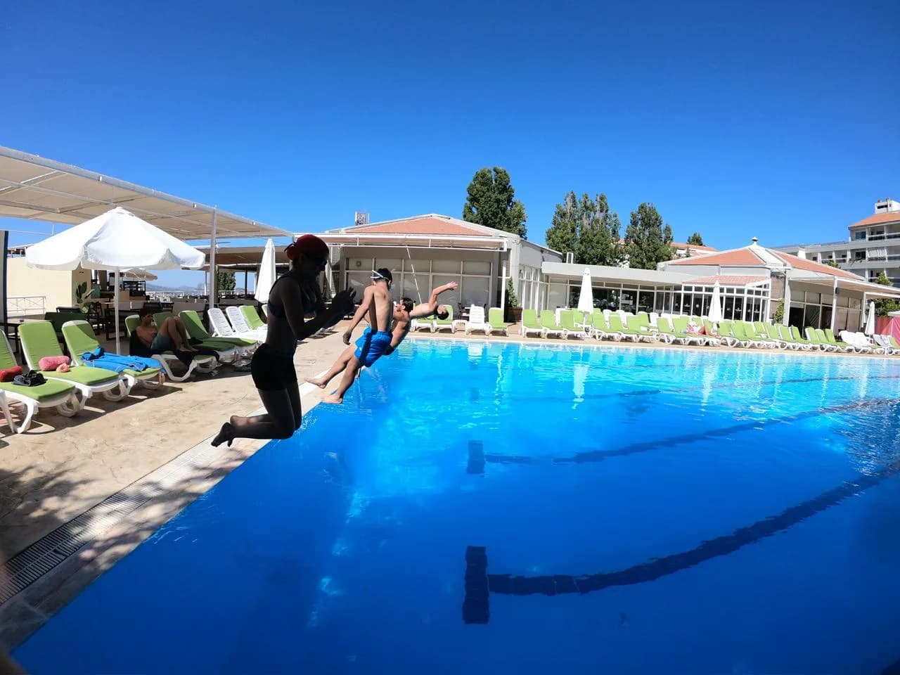 Swimmers training at an outdoor pool